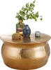 A decorative table with various items on top. Produktbild-Vorschau