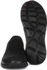 A black slip-on shoe is shown from the side and the sole is displayed separately. Voir les images du produit