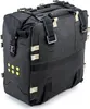 A black adventure saddlebag with tan straps and buckles, shown against a white background. Produktbild-Vorschau