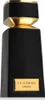 A product shot of a black and gold perfume bottle. Voir les images du produit