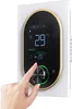A hand is shown adjusting a digital thermostat mounted on a wall. Produktbild-Vorschau