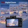 A digital camera displaying a zoomed-in image of a snowy village, with smaller inset images showing different zoom levels. Produktbild-Vorschau