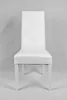 A white dining chair is shown from the front against a light gray background. Voir les images du produit