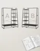 Two identical black garment racks with shelves, labeled A and B, are shown, along with an open instruction manual. Náhled obrázku produktu