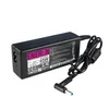 A black laptop power adapter with a coiled black cord and a blue-tipped connector, shown against a white background. Podgląd zdjęcia produktu