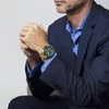 A man wearing a suit and watch. Produktbild-Vorschau