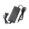 A black power adapter with two cables, one with a European plug and the other with a barrel connector, is shown on a white background. Produktbild-Vorschau