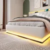 A modern white bed with LED lighting and a tufted headboard, set in a bedroom with abstract art on the wall. Anteprima dell’immagine prodotto