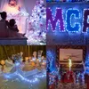 A collage of four festive scenes, including a Christmas tree, decorative letters, a cake table, and a fireplace mantel, all adorned with lights. Produktbild-Vorschau