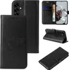 A collage of images showing a black flip phone case with a floral and butterfly design, demonstrating its different angles and features. Produktbild-Vorschau