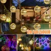 A collage of images showing solar-powered string lights with decorative Moroccan-style globes, some in outdoor settings and some in close-up. Produktbild-Vorschau