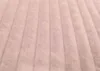 A close-up view of a pink corduroy fabric with vertical ribs. Podgląd zdjęcia produktu