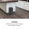 A dark gray sensor trash can is placed on a wooden floor next to a kitchen island. Produktbild-Vorschau
