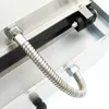 Close-up of a metal hose connected to a piece of equipment. Produktbild-Vorschau