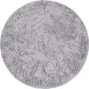 A round, fluffy rug on a white background. Anteprima dell’immagine prodotto