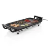 An electric griddle with food items on it, set against a white background. Produktbild-Vorschau
