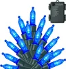 A cluster of blue LED string lights with a battery pack shown in the upper right corner. Produktbild-Vorschau