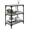 A three-tiered bookshelf with decorative items on each shelf. Produktbild-Vorschau