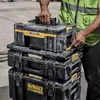 A person wearing a high-visibility vest is stacking toolboxes. Anteprima dell’immagine prodotto