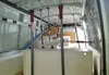 The interior of a van being outfitted with shelving and support poles. Produktbild-Vorschau
