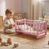 Ein Puppenbett aus Holz, eine rosa Wiege mit grauer Produktbild-Vorschau 5