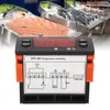 A digital temperature controller is shown in the foreground, with a blurred background of a fish market display. Podgląd zdjęcia produktu