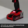 Close-up of the base of a red and black power drill, showing the battery pack and an LED light. Produktbild-Vorschau