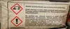 A close-up of a bag with warning labels and instructions. Náhľad obrázku produktu