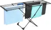 A black metal drying rack with several towels draped over it, set against a white background. Produktbild-Vorschau