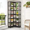 A corner shelf unit filled with potted plants on a patio or balcony. Náhled obrázku produktu