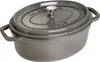 A gray Staub oval cocotte pot with a lid. Voir les images du produit