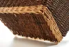 A close-up view of the corner of a woven basket, showing the texture and two-tone color. Náhľad obrázku produktu