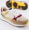 A pair of colorful sneakers is shown against a white background, with one shoe in the foreground and the sole of another shoe visible in the background. Produktbild-Vorschau