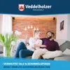 A couple relaxing on a couch in a living room. Produktbild-Vorschau