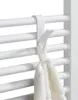 A close-up of a white towel hook attached to a white radiator, with a white towel hanging from it. Podgląd zdjęcia produktu