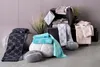 A collection of Joop! brand towels displayed in a staged setting with decorative elements. Produktbild-Vorschau