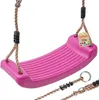A pink plastic swing seat with ropes and connectors, shown against a white background.