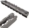 A close-up, studio shot of a gray plastic cleaning tool with black bristles, shown from multiple angles against a white background. Produktbild-Vorschau