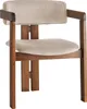 A close-up shot of a modern wooden chair with beige upholstery. Produktbild-Vorschau