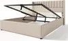 A beige upholstered bed frame with its mattress support mechanism lifted, revealing the storage space underneath. Anteprima dell’immagine prodotto