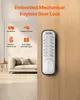 A mechanical keyless door lock is shown mounted on a wooden door, with interior furniture visible in the background. Náhled obrázku produktu