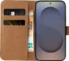 A brown leather flip case for a smartphone, with slots for cards and cash, and a smartphone inserted. Produktbild-Vorschau
