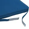 A close-up view of a blue cushion with attached straps and velcro fasteners. Anteprima dell’immagine prodotto