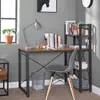 A desk setup with a computer, books, and a chair in a room. Produktbild-Vorschau