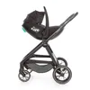A black baby car seat attached to a stroller, shown from the side against a white background. Náhľad obrázku produktu