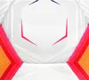 A close-up view of a white soccer ball with pink and yellow accents. Produktbild-Vorschau