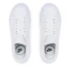 A top-down view of a pair of white Nike sneakers. Náhled obrázku produktu