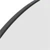 A close-up view of the edge of a mirror with a dark frame. Náhľad obrázku produktu