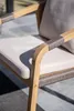 Close-up of an outdoor chair with wooden frame and woven rope details. Produktbild-Vorschau