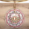 A top-down view of a decorative basin with a colorful mandala pattern, mounted on a wooden surface. Náhled obrázku produktu